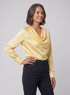 Dalia draped cowl-neck blouse in yellow on model