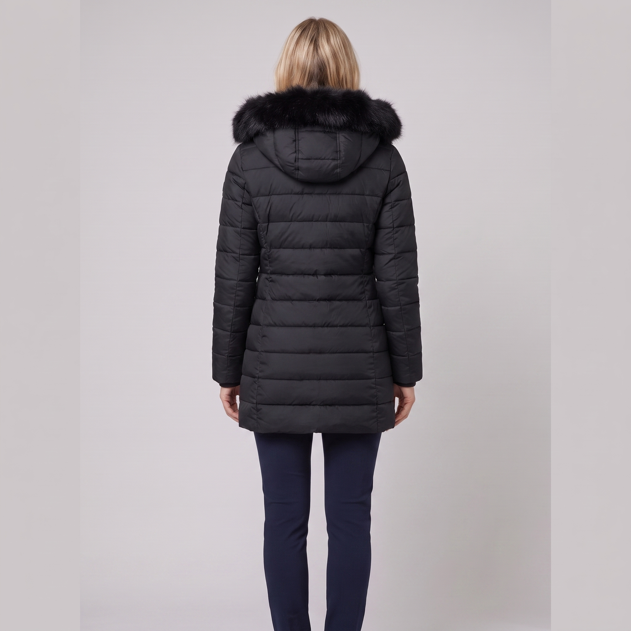Evara lightweight hooded puffer jacket in black, back view on model