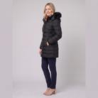 Evara lightweight hooded puffer jacket in black, side view on model