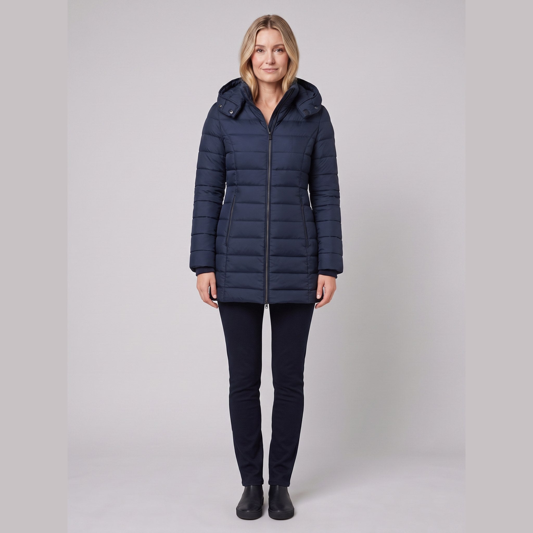 Evara lightweight hooded puffer jacket in navy on model