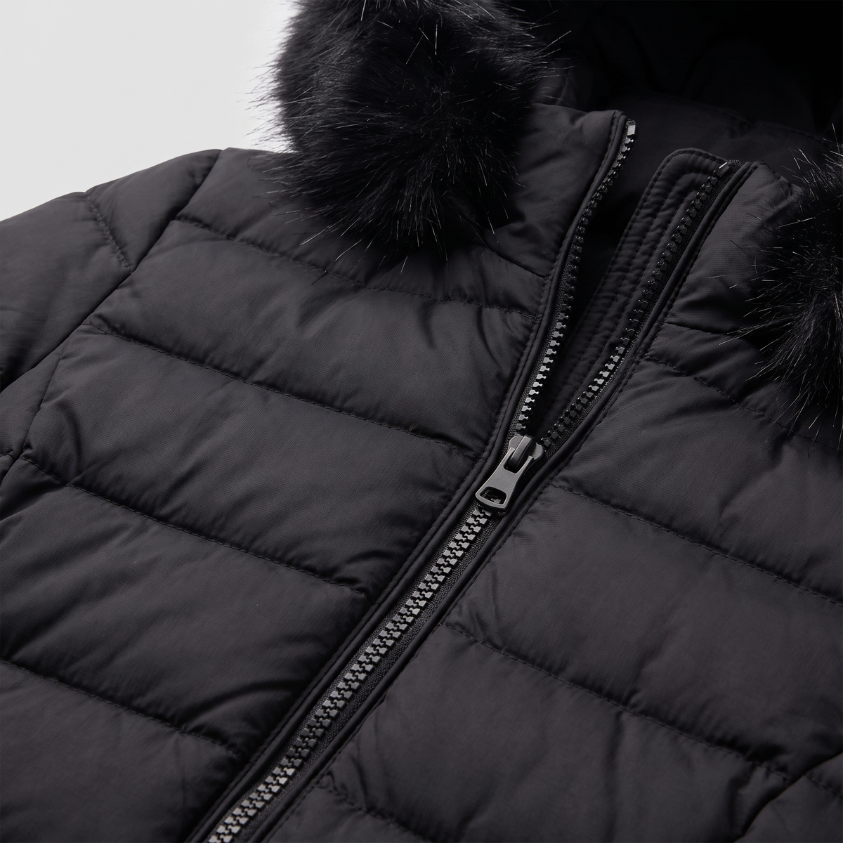 Evara puffer jacket quilting, zip and fur hood trim close-up
