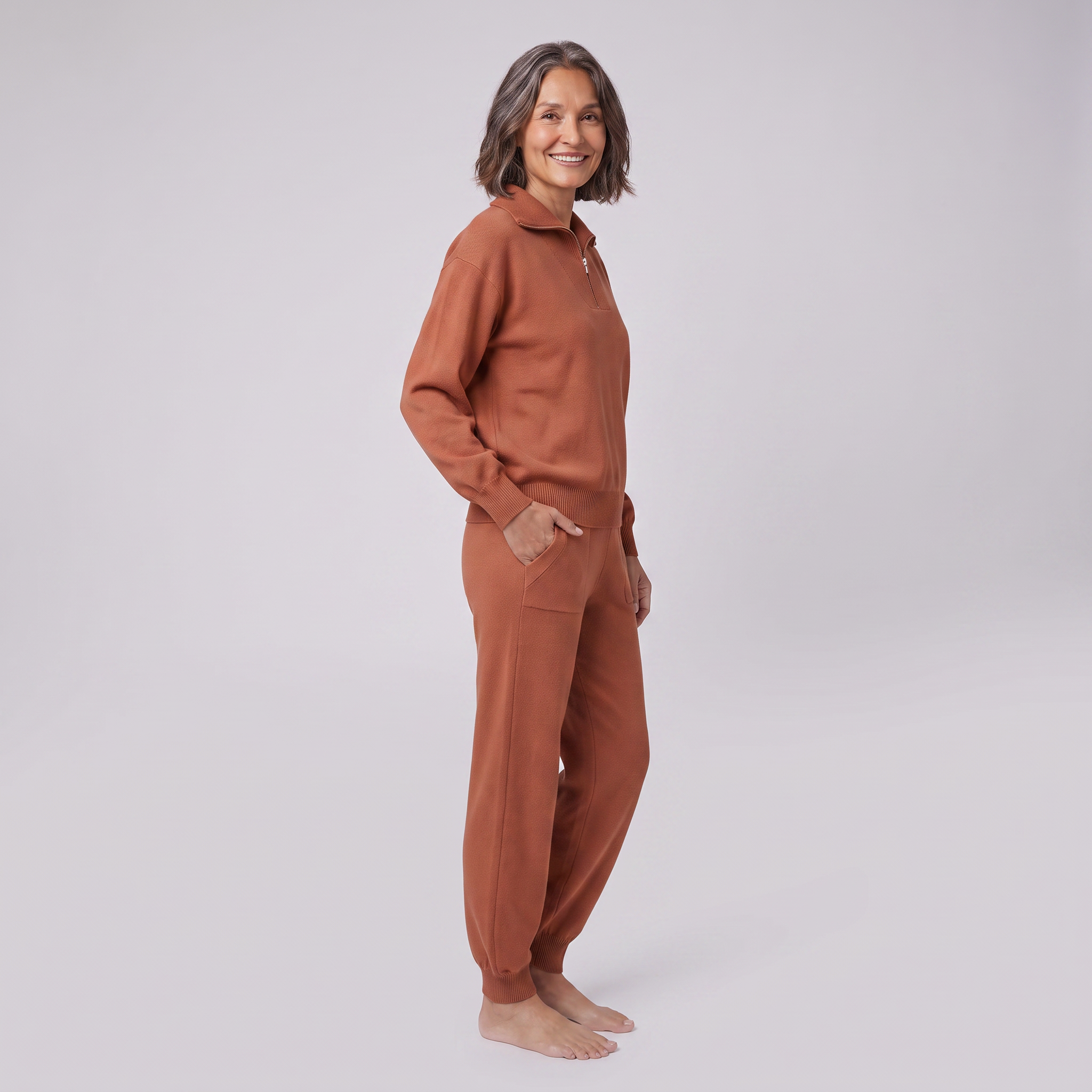 Fjorda half-zip knit lounge set in rust, side view on model
