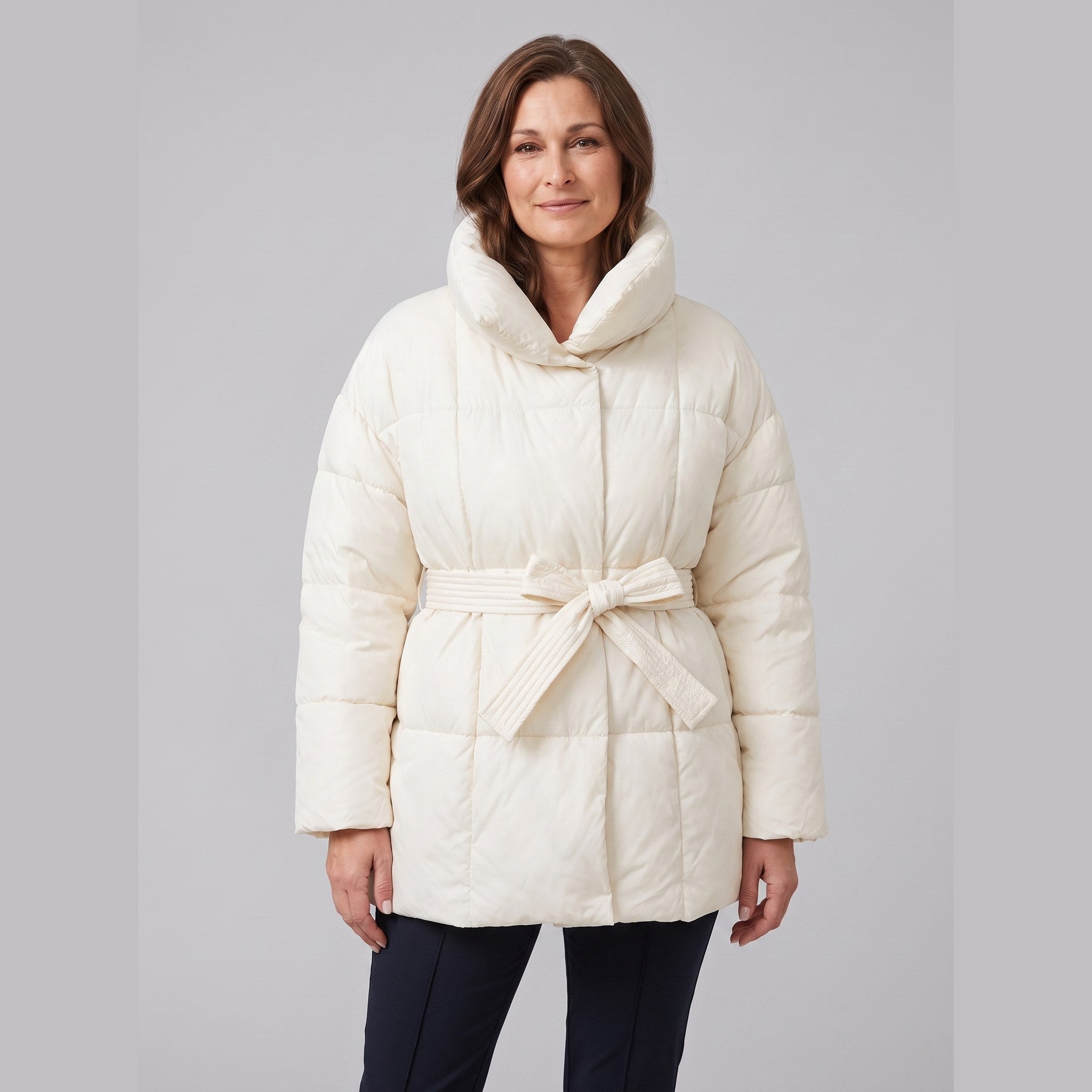 Haven belted puffer coat in cream on model