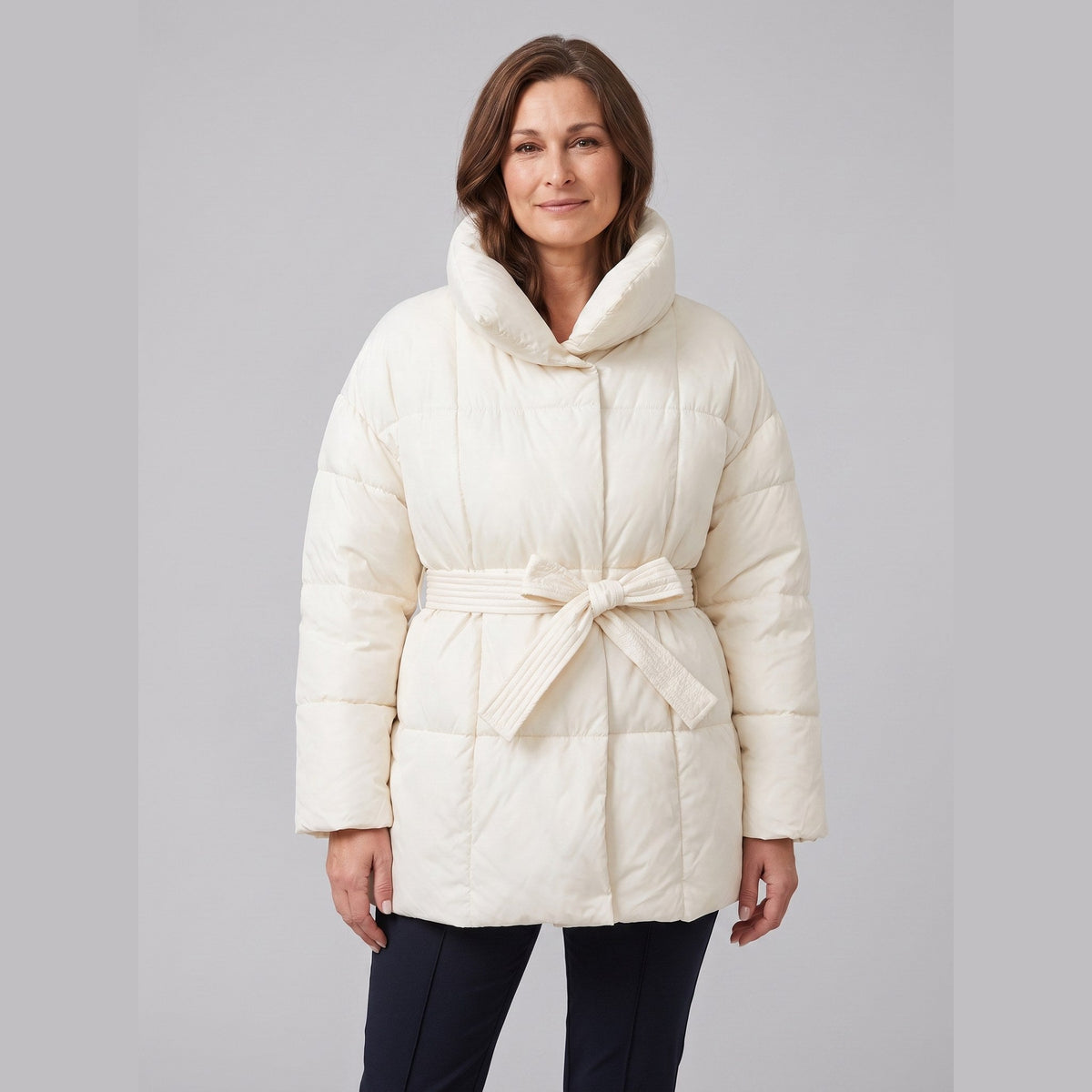 Haven belted puffer coat in cream on model