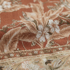 Brown floral print fabric close-up detail, delicate pattern with border hem
