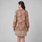 Brown floral shift mini dress, back view on model showing silhouette