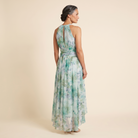 Poppy Dress green floral halter midi back view on model