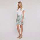Pamela Boutique mint floral pleated shorts tie belt, model side view