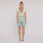 Pamela Boutique mint floral pleated shorts tie belt, model back view