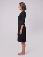 Ilona belted split-sleeve midi dress in black, side view on model