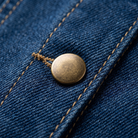 Indra denim set button and topstitching close-up