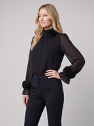 Iona sheer chiffon blouse with 3D rosettes in black on model
