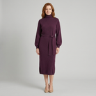 Isabella wool-blend turtleneck knit midi dress in plum on model