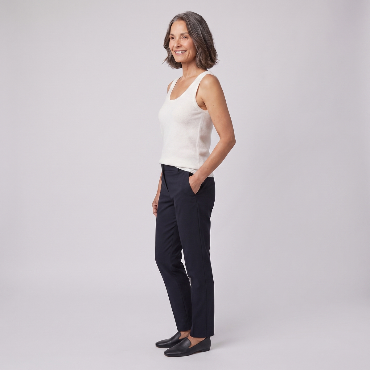 Ivanna sleeveless knit vest in ivory, side view on model