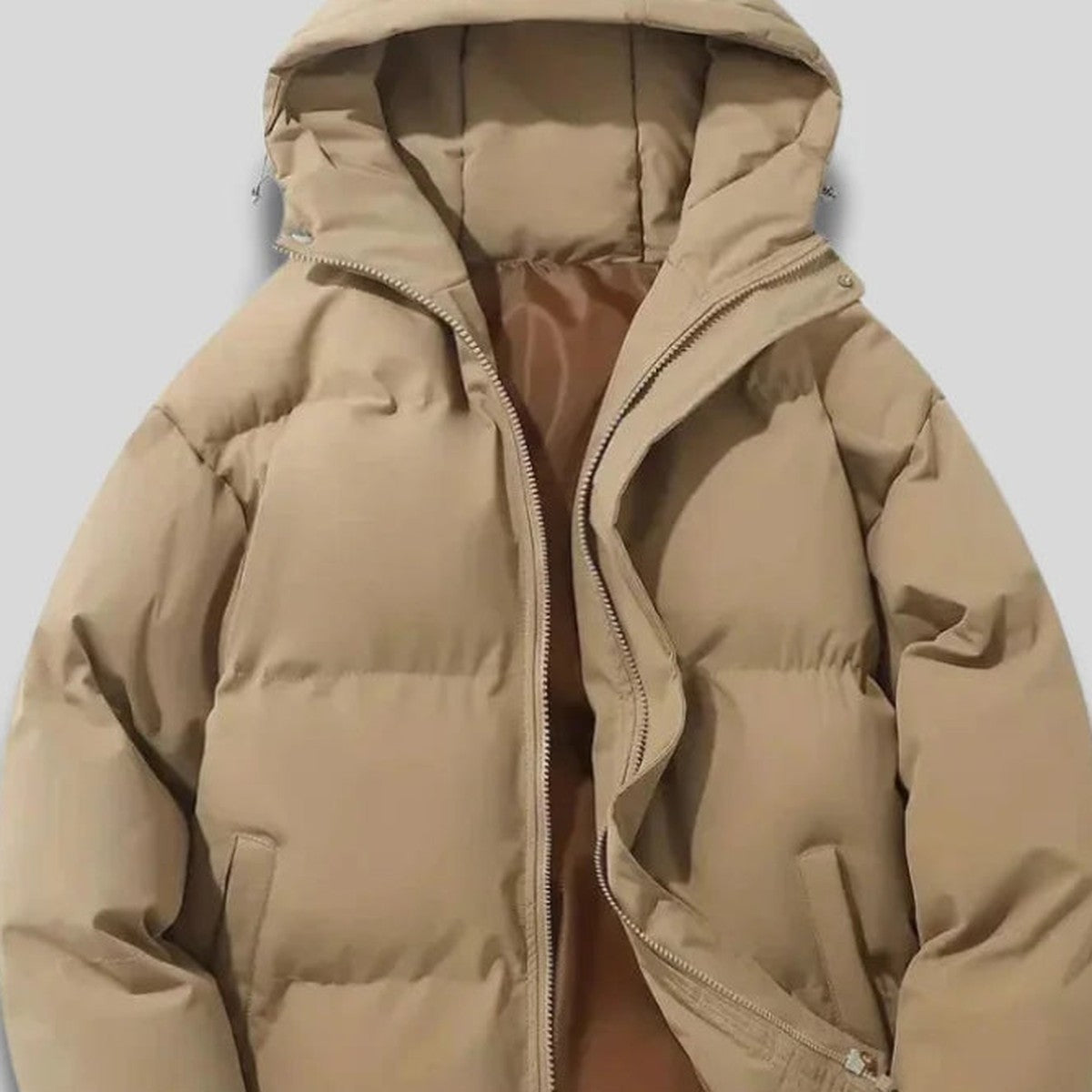 Close-up of women's beige hooded puffer jacket
