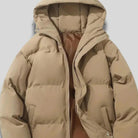 Close-up of women's beige hooded puffer jacket