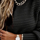 Close-up of women's oversized chunky knit longline jumper