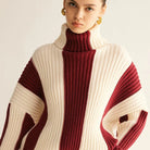 Close-up of women's colour block ribbed roll neck jumper
