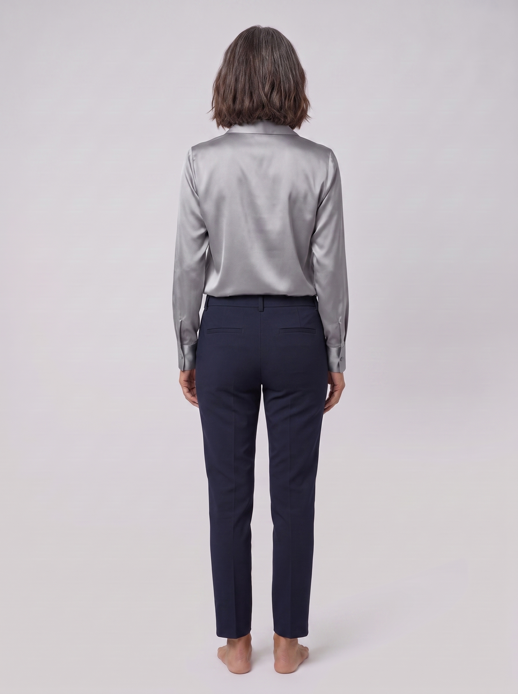 Lena metallic V-neck blouse in silver, back view on model