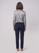 Lena metallic V-neck blouse in silver, back view on model