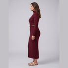 Liora stretch-rib turtleneck midi dress in burgundy, side view on model