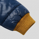 Mila puffer jacket ribbed cuff and quilting close-up