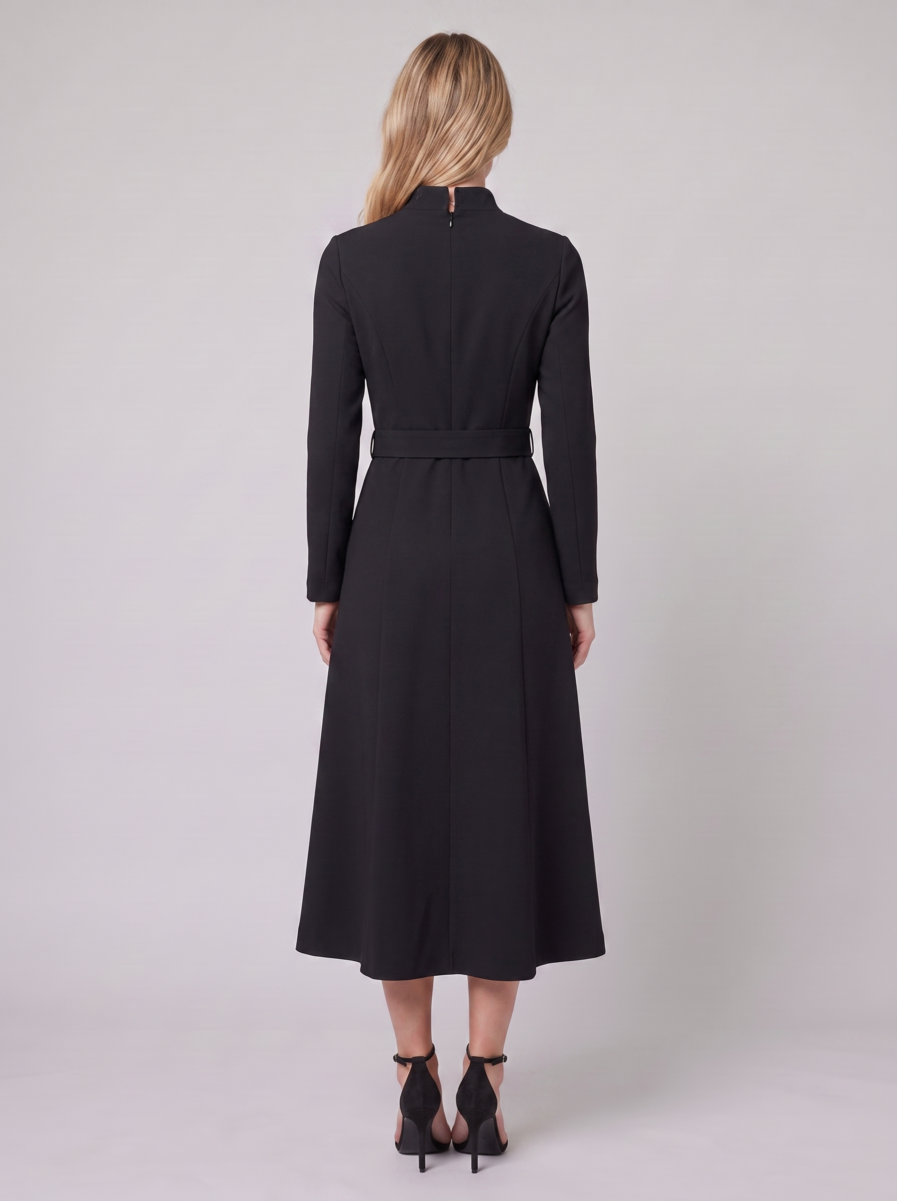 Nola belted A-line midi dress in black, back view on model