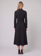 Nola belted A-line midi dress in black, back view on model