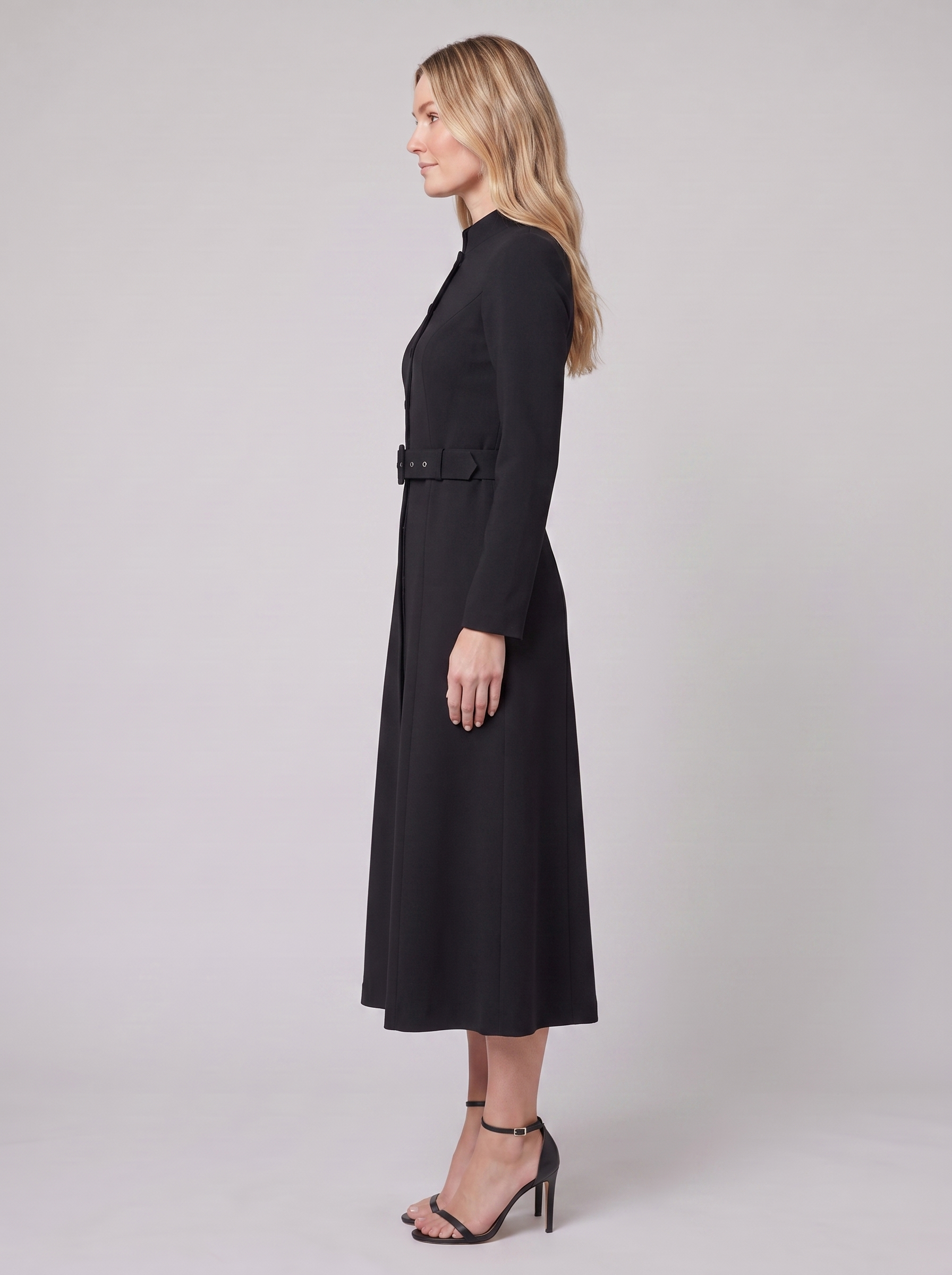Nola belted A-line midi dress in black, side view on model