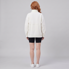 Paloma oversized half-zip sweatshirt in cream, back view on model
