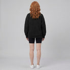 Paloma oversized half-zip sweatshirt in jet black on model