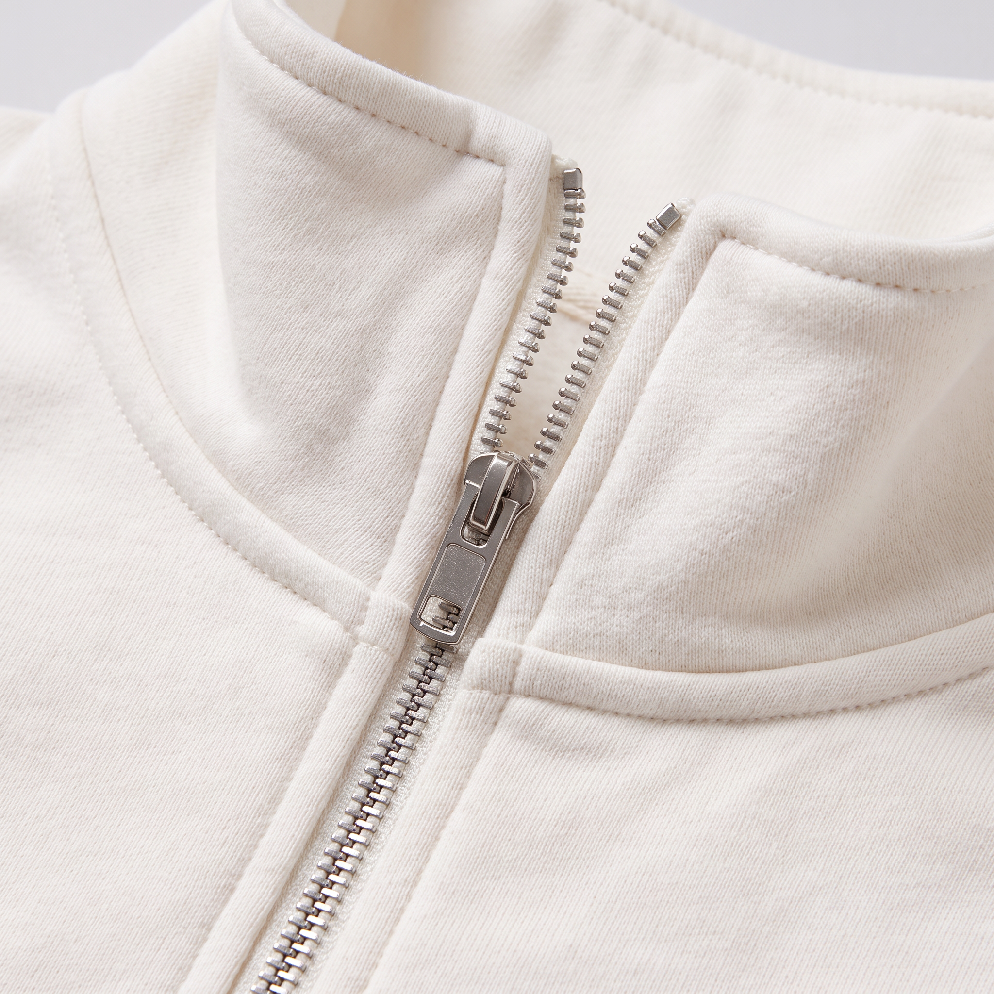Paloma half-zip sweatshirt collar and zip close-up