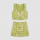 Lime green linen co-ord set, product flat-lay of vest top and mini skirt