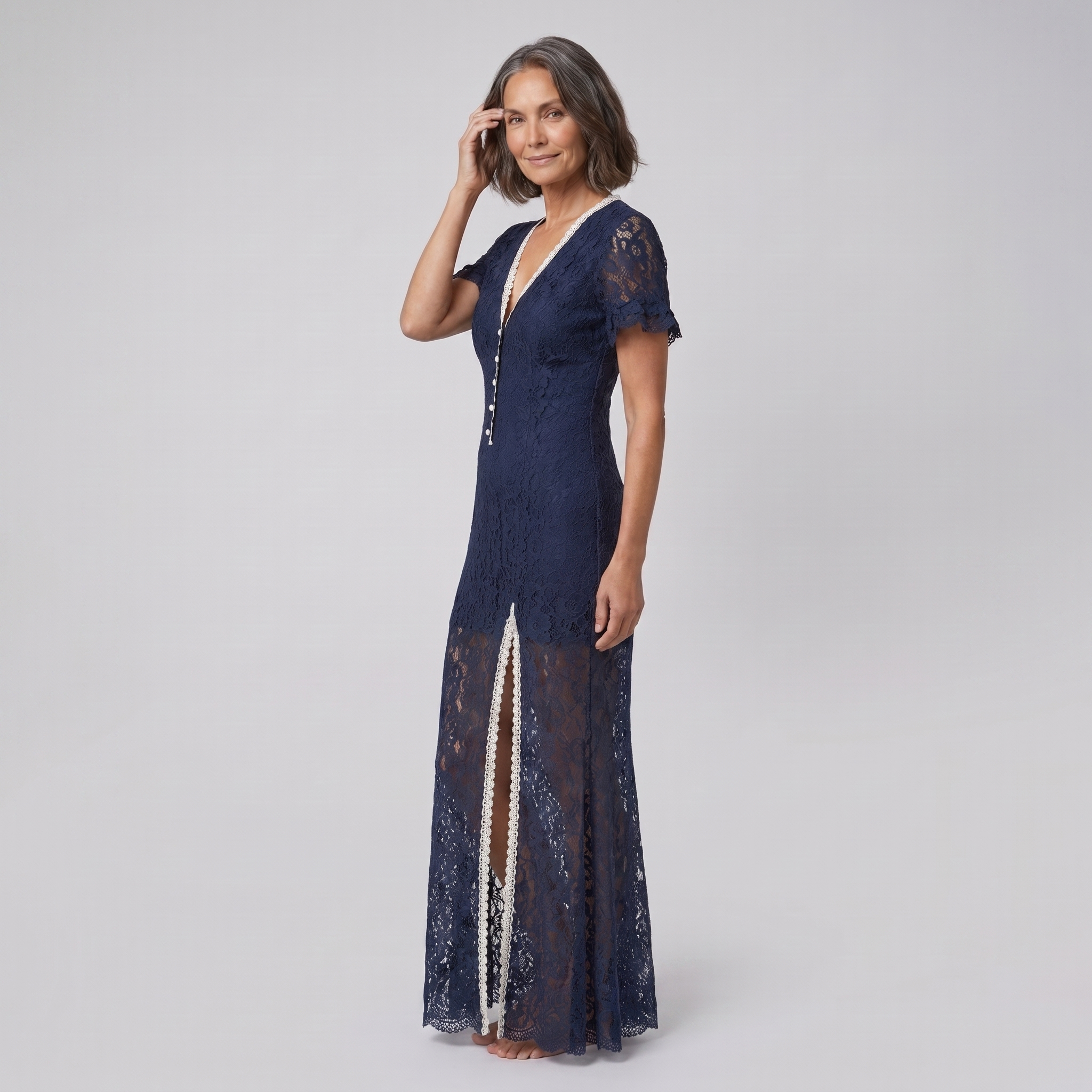 Bora Midi Dress in navy floral lace, model three-quarter side view — side