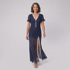Bora Midi Dress in navy floral lace, model walking shot — walk