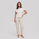 Pamela Boutique white broderie blouse flutter sleeve scalloped hem, model front view