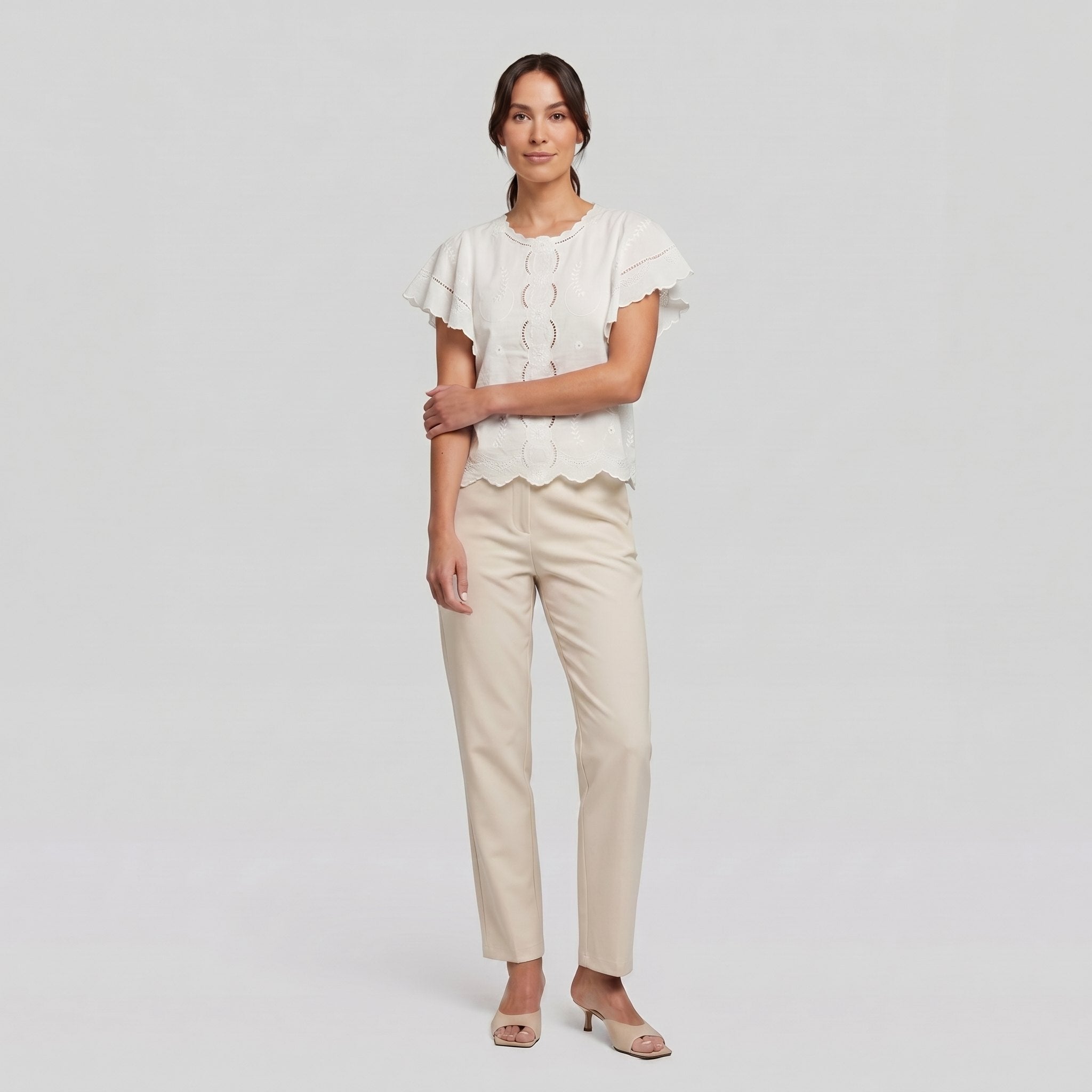 Pamela Boutique white broderie blouse, model side pose