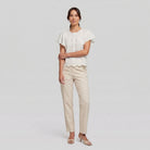 Pamela Boutique white broderie blouse, model side pose