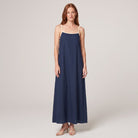 Navy spaghetti-strap maxi slip dress with cream trim, front view