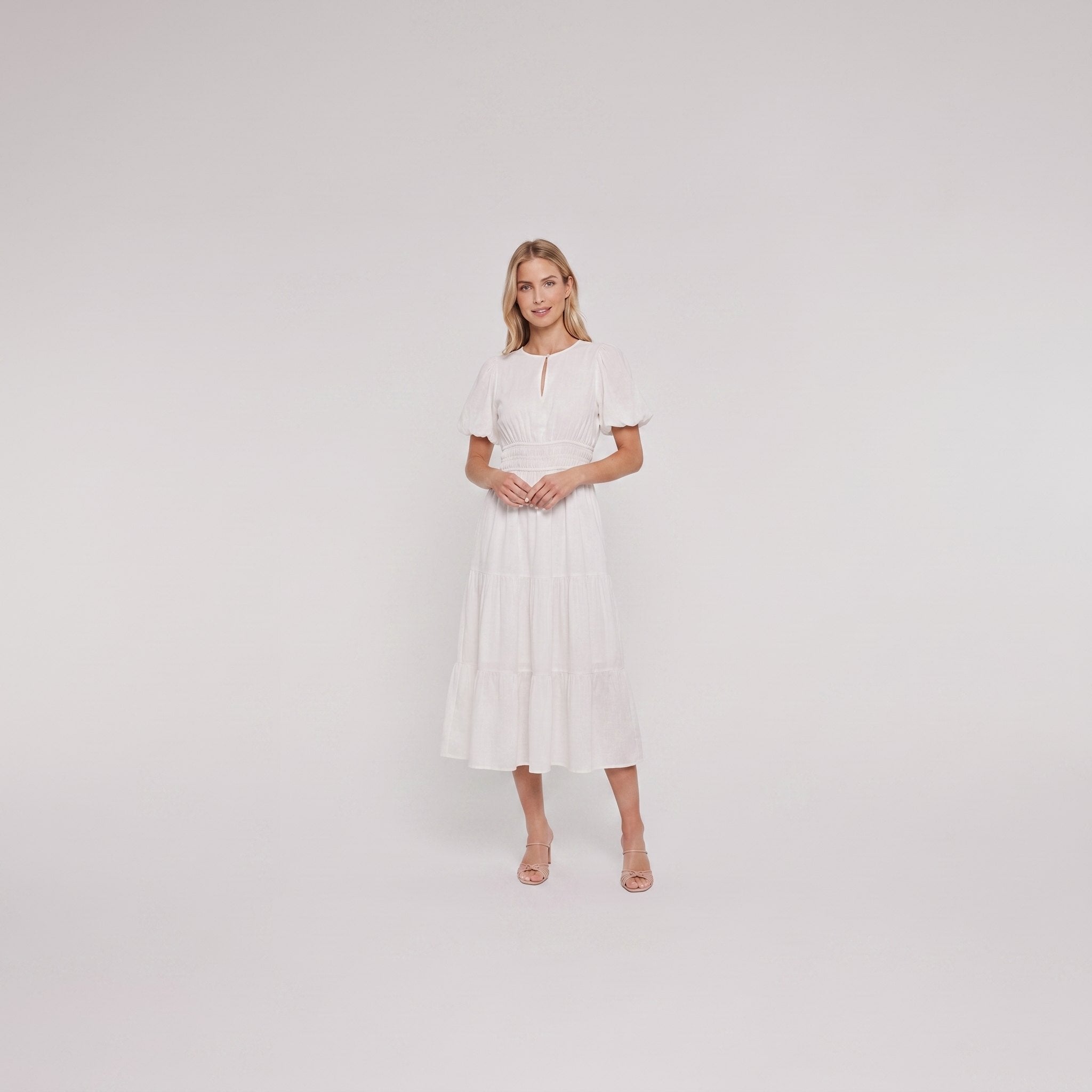 White cotton midi dress with keyhole neckline, full-length on model