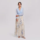 Floral maxi wedding guest dress, side pose on model