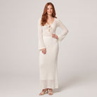 Ivory crochet knit maxi dress with bell sleeves, front view on model