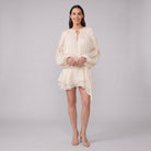 Cream ivory pleated chiffon mini dress, front view hands clasped