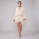 Cream ivory pleated chiffon mini dress, walking pose