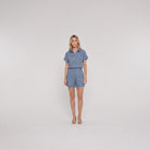 Chambray blue linen camp-collar shirt and high-waist shorts set, front view on model