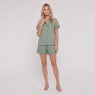 Sage green linen camp-collar shirt and high-waist shorts set, front view on model
