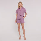 Mauve purple linen camp-collar shirt and high-waist shorts set, front view on model