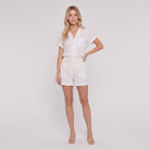 White linen camp-collar shirt and high-waist shorts set, front view on model