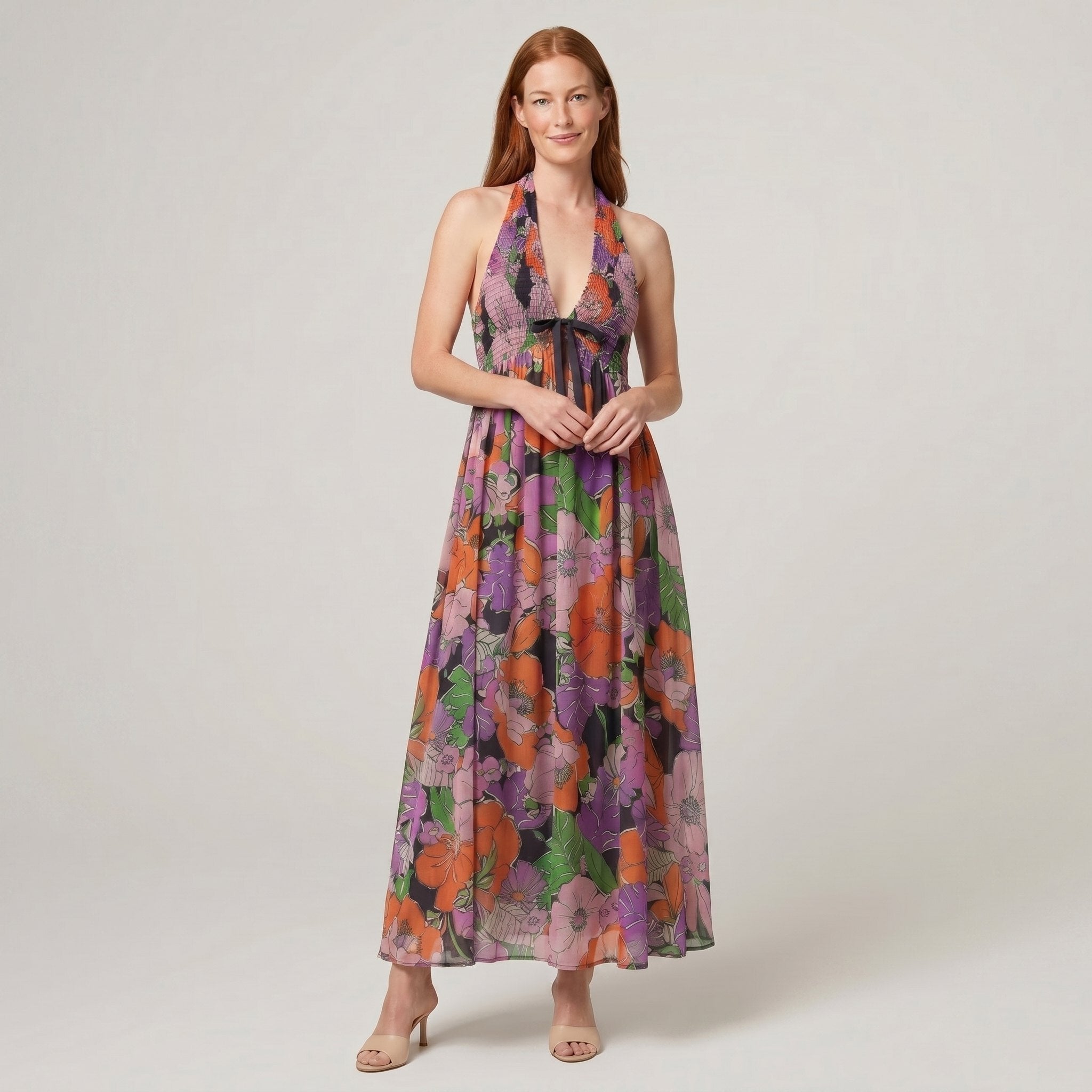 Fiona Maxi Dress in Tropical floral print - navy halter-neck maxi dress with orange and purple flowers on model