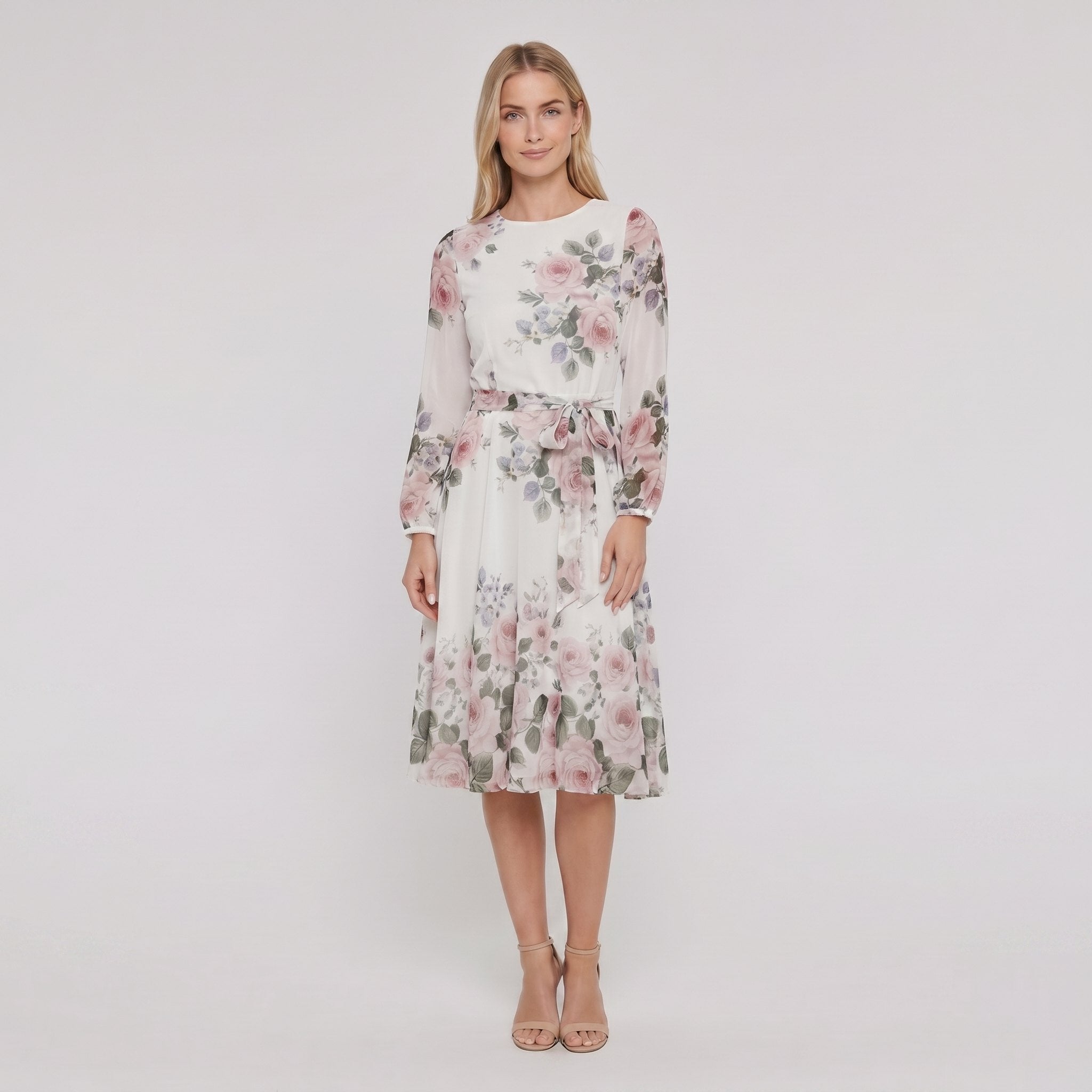 Model wearing white floral A-line midi dress with tie belt, front view